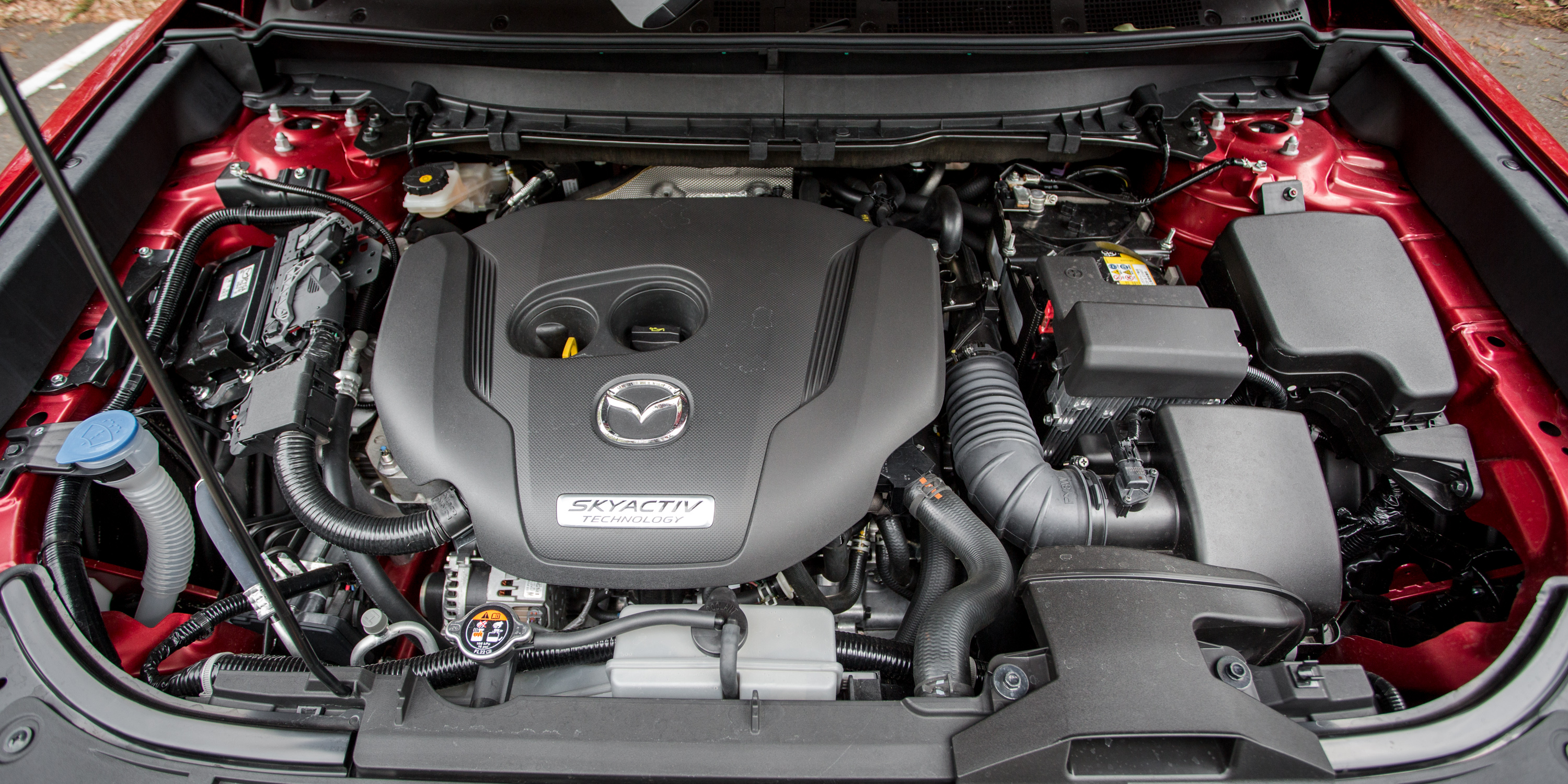 Двигатель мазда cx5. Mazda CX 5 двигатель. Моторный отсек Мазда сх5. Мазда CX 9 двигатель.